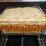 Casserole dish with noodles, sauce, and bechamel layers